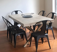 Image of cowes retreat dining room complete with table for guests.