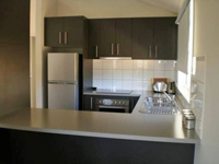 Cowes retreat kitchen is ready for your meals. Complete with all the amenities to cook yourself or order in from one of the many cowes restaurants.